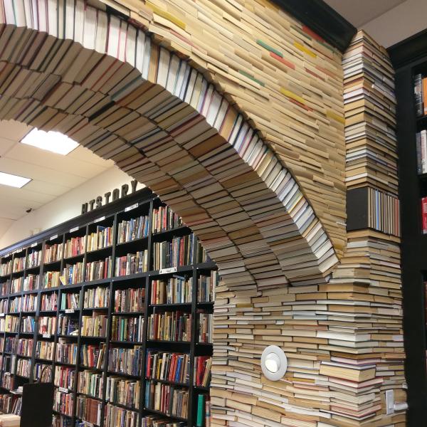 A close-up picture of the Book Arch at Sandman Books Punta Gorda, Florida. Used New Library Bookstore Sell Rainbow Picture Photo Op Opportunity Tourism Tourist Sustainable Artwork Art Local Art Sculpture 