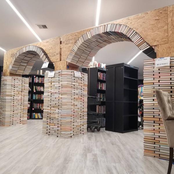 The book arch in the process of being carefully reconstructed at our new location.  Book Arch in Sandman Books Punta Gorda Florida. Florida Tourism Tourist Local Art Artist Artwork Fantasy Harry Potter Beauty and the Beast Disney Wedding Photography Unconventional Unique Venue Sell Used New Books Bookstore Bookshop Library  