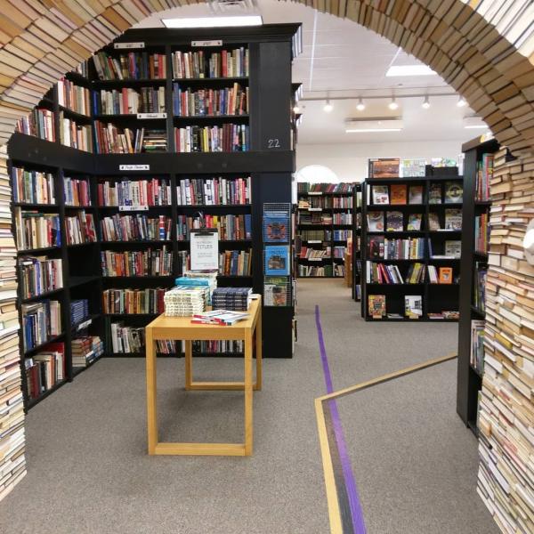 A close-up of one arch of the Book Arch local sustainable artwork installation at Sandman Books Bookstore, Punta Gorda, Florida. Florida Tourism Tourist Local Art Artist Artwork Fantasy Harry Potter Beauty and the Beast Disney Wedding Photography Unconventional Unique Venue Sell Used New Books Bookstore Bookshop Library  