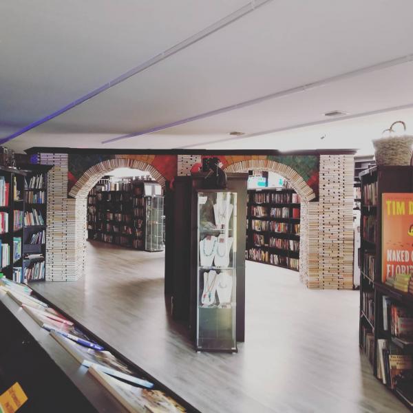 A wide shot of the entire Book Arch in Sandman Books Punta Gorda Florida. Florida Tourism Tourist Local Art Artist Artwork Fantasy Harry Potter Beauty and the Beast Disney Wedding Photography Unconventional Unique Venue Sell Used New Books Bookstore Bookshop Library  