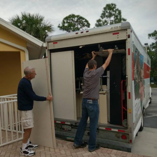 Scott Hill and his father load the truck to move the book arch.  Book Arch in Sandman Books Punta Gorda Florida. Florida Tourism Tourist Local Art Artist Artwork Fantasy Harry Potter Beauty and the Beast Disney Wedding Photography Unconventional Unique Venue Sell Used New Books Bookstore Bookshop Library  