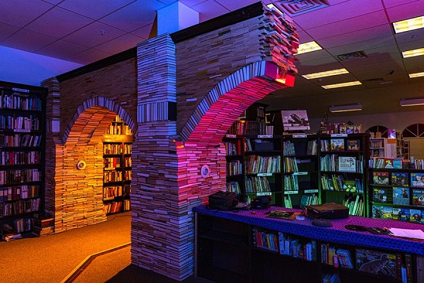 Book Arch by David Sussman. A wide shot of the Book Arch in Sandman Books Punta Gorda Florida. Florida Tourism Tourist Local Art Artist Artwork Fantasy Harry Potter Beauty and the Beast Disney Wedding Photography Unconventional Unique Venue Sell Used New Books Bookstore Bookshop Library Local Photography Gallery 